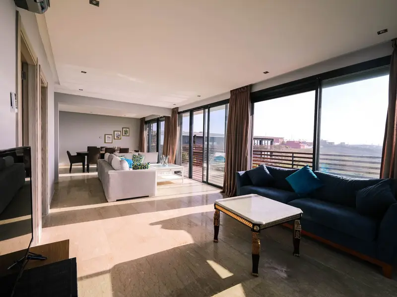 Bright apartment living room with large windows