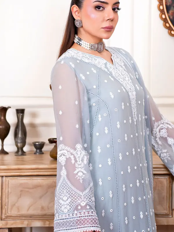 Model wearing a white chikankari kurta