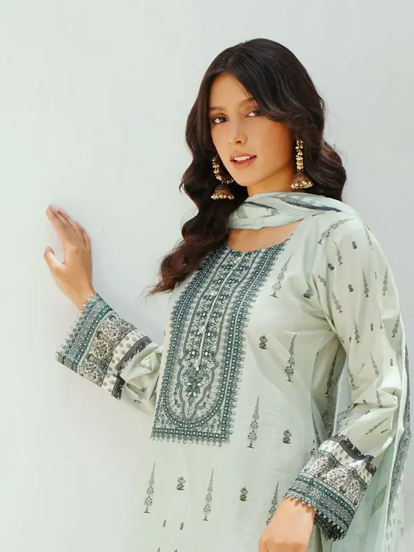 Model wearing a mint embroidered three-piece lawn suit